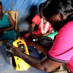 Women in South Sudan listen to radio