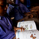 South Sudan boy reading